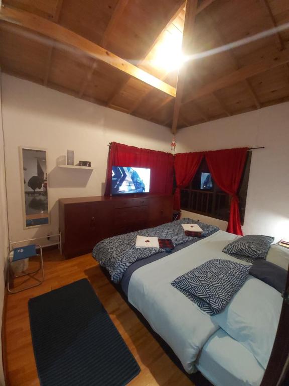 En eller flere senge i et værelse på CAMPIÑA SUIZA