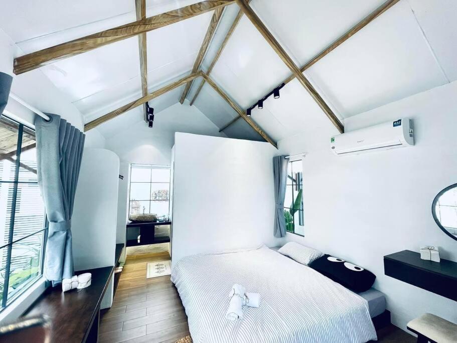 Un pat sau paturi într-o cameră la Villa 3 Room Phan Thiết