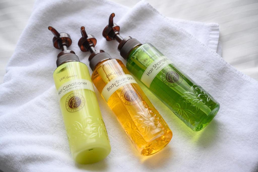 three bottles of wine on a white towel at HOTEL MYSTAYS Kanazawa Castle in Kanazawa