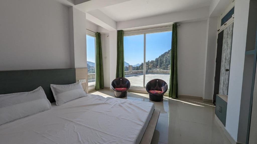 Postel nebo postele na pokoji v ubytování El Cielo, B&B