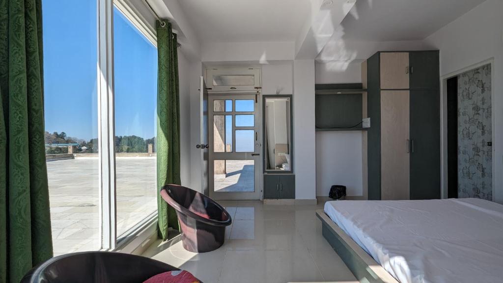 Postel nebo postele na pokoji v ubytování El Cielo, B&B