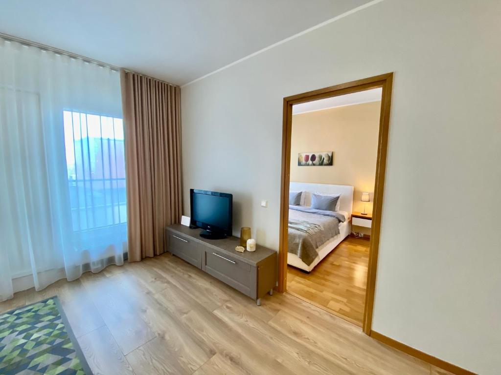 Postel nebo postele na pokoji v ubytování Cozy Foorum Apartment - Tallinn City Centre