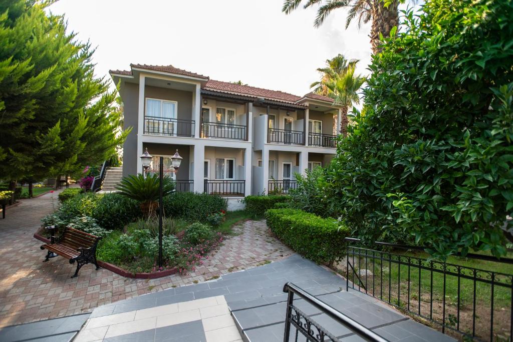 a building with a bench in front of it at ESTERIA PARK RESORT in Antalya
