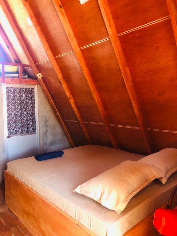 Postel nebo postele na pokoji v ubytování Nilaveli Sheen Coast