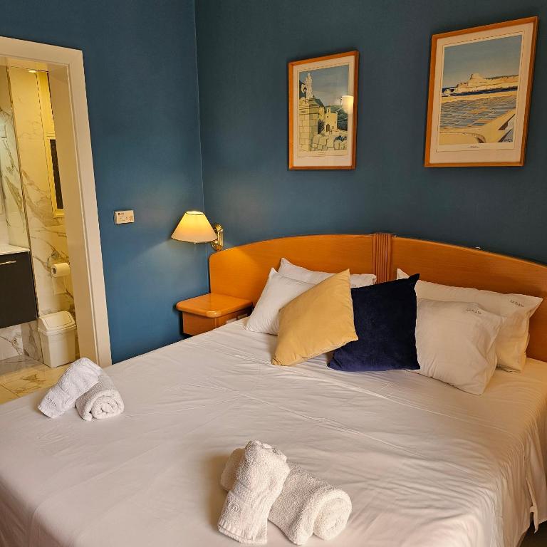Postel nebo postele na pokoji v ubytování La Playa Hotel