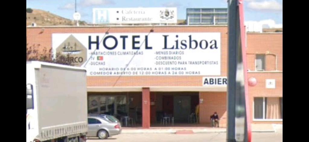 a hotel liscota sign on the side of a building at HOTEL LA GUAREÑA in Castrillo de la Guareña