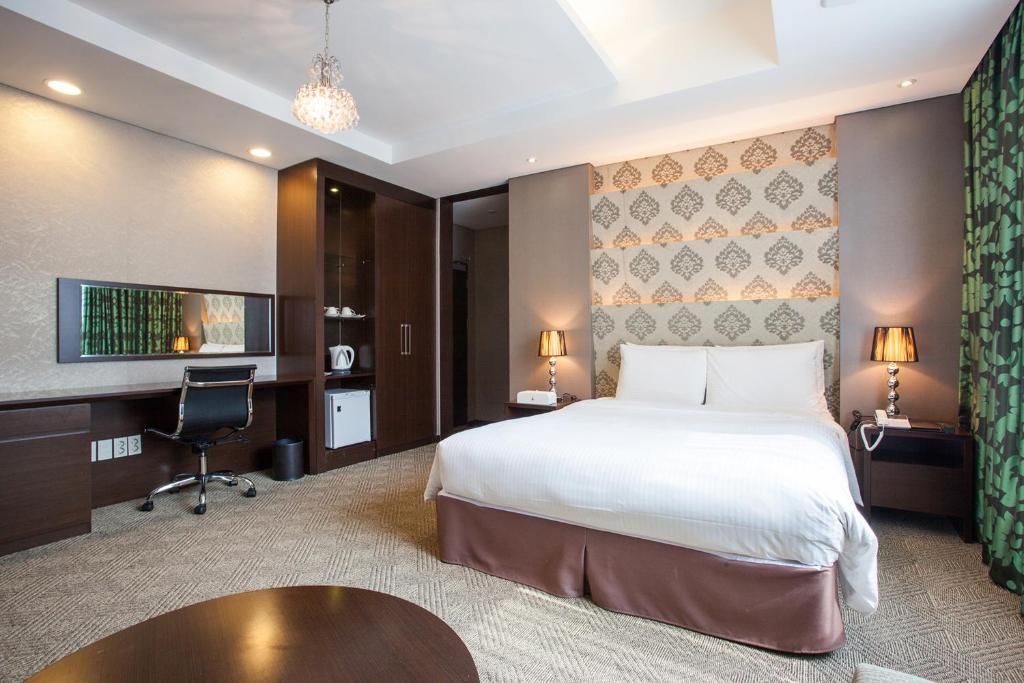 Postel nebo postele na pokoji v ubytování Hotel Pharos