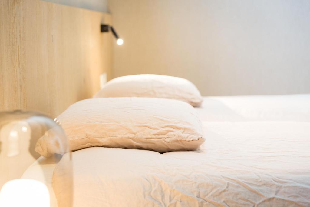 Postel nebo postele na pokoji v ubytování Hotel Den Berg
