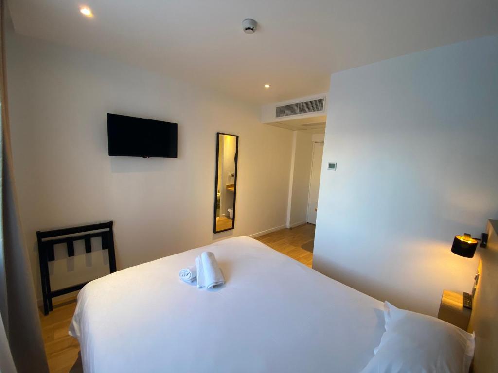 Postel nebo postele na pokoji v ubytování Oskar Hotel