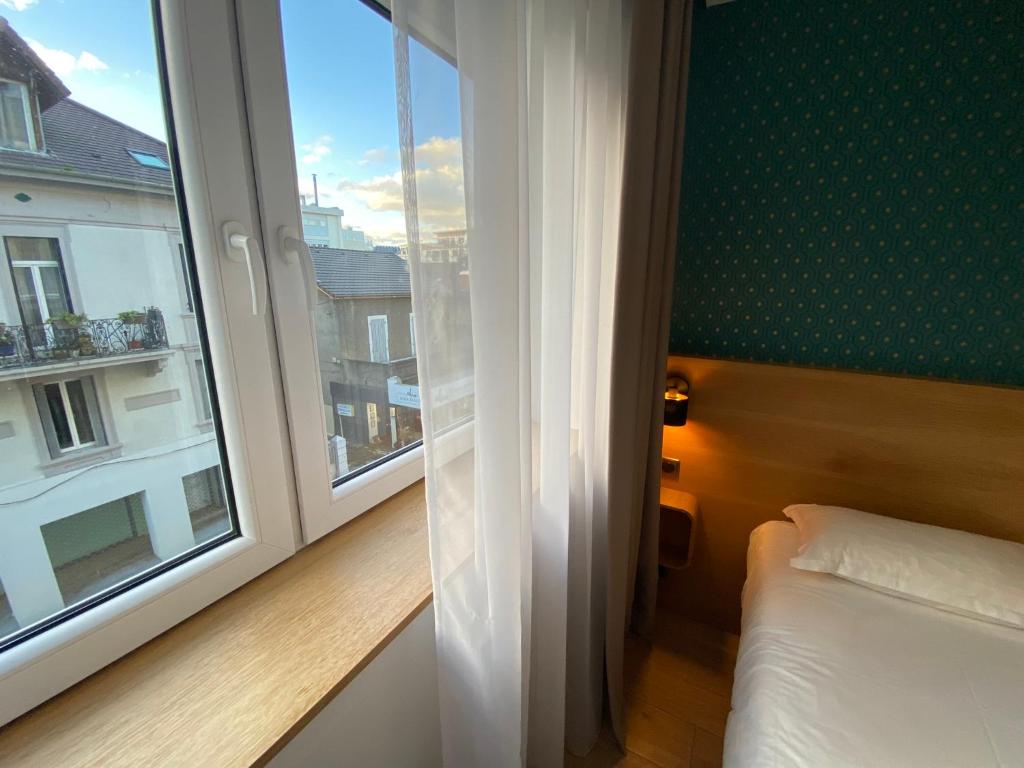 Postel nebo postele na pokoji v ubytování Oskar Hotel