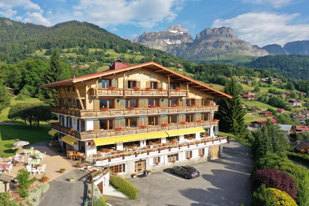 an aerial view of a hotel with mountains in the background at Le Chamois d'Or in Cordon
