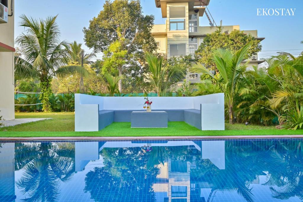 a view of the pool at the villa at EKOSTAY - Bloomfield Villa in Alibaug