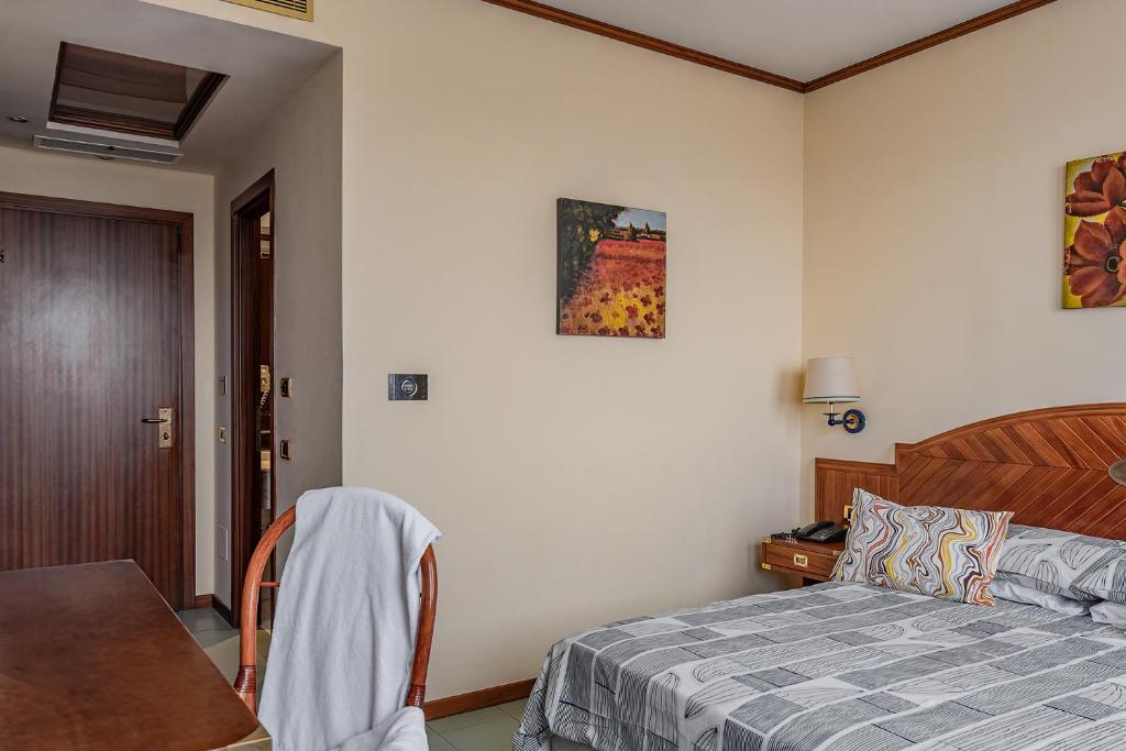 Postel nebo postele na pokoji v ubytování Vintage Hotel Tornese - Business & Events
