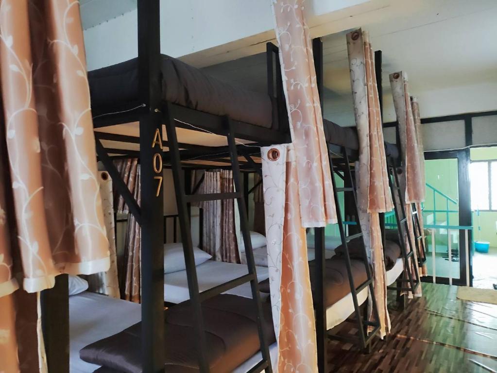 Postel nebo postele na pokoji v ubytování Hug pai hostel