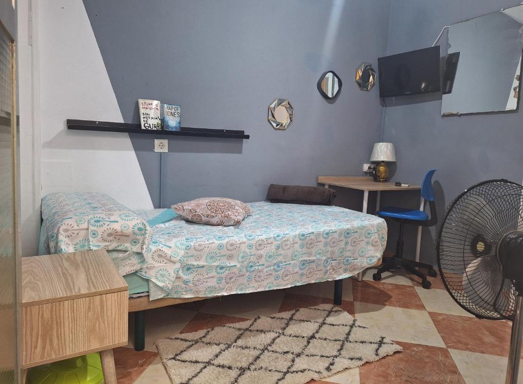 Televízia a/alebo spoločenská miestnosť v ubytovaní Ikigai House