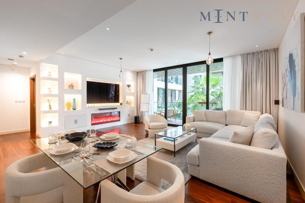 a living room with a couch and a table at City Walk Building 2B - Al Wasl, Jumeirah - Mint Stay in Dubai