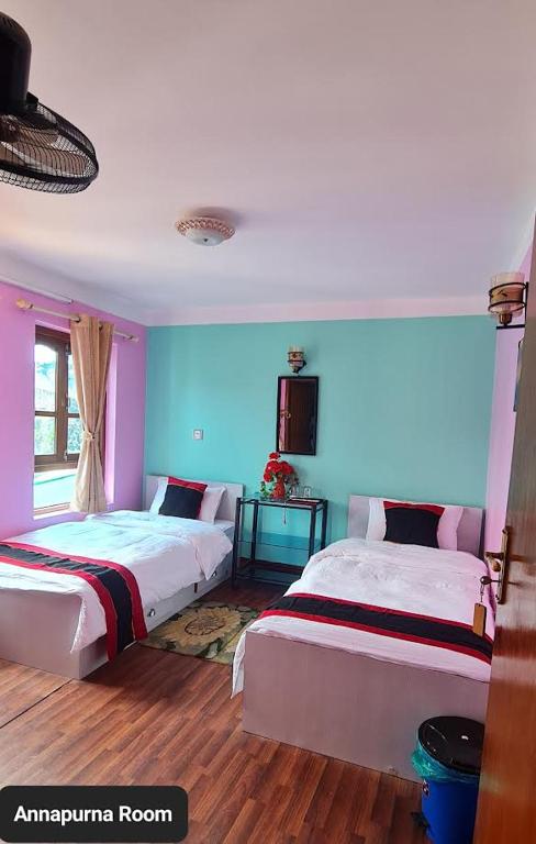 Postel nebo postele na pokoji v ubytování Annapurna Guest House and Rooftop Restaurant