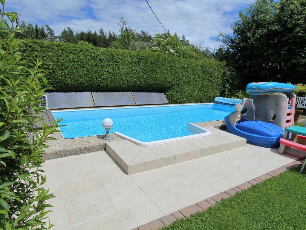 a swimming pool with a inflatable limbo at Holiday home in Wernberg with pool and sauna in Wernberg