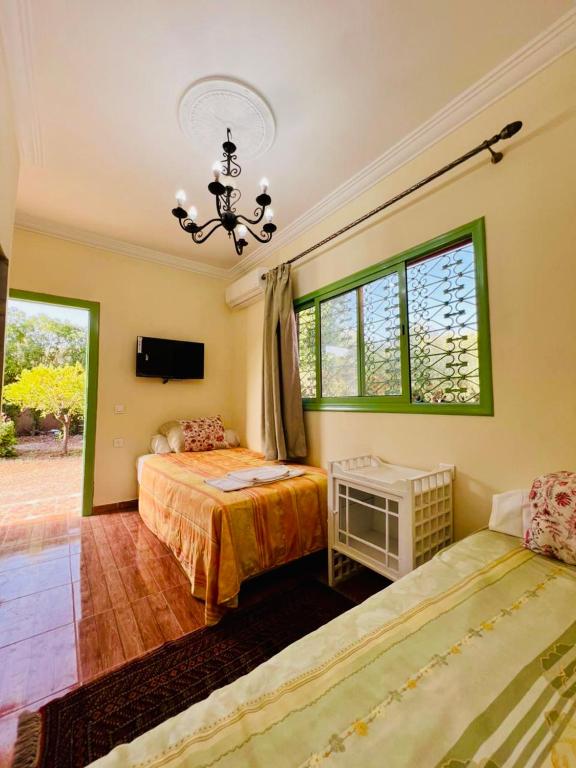 Postel nebo postele na pokoji v ubytování Villa Baddi Marrakech