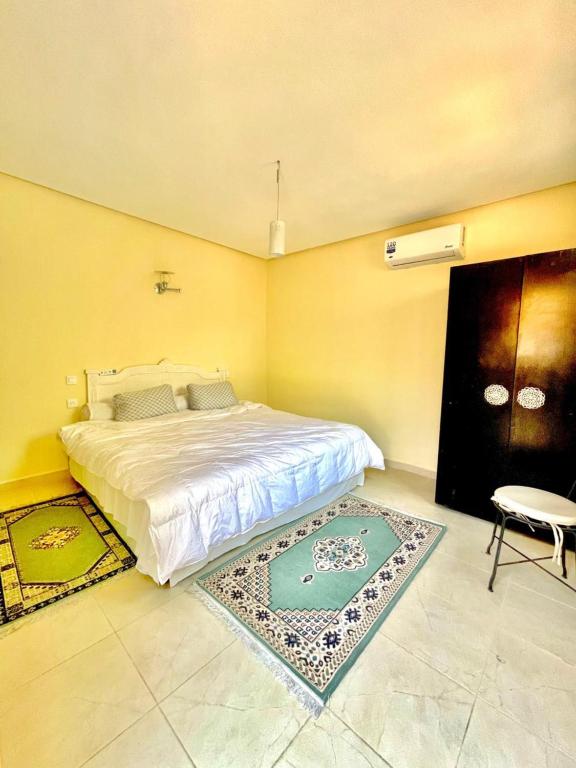 Postel nebo postele na pokoji v ubytování Villa Baddi Marrakech
