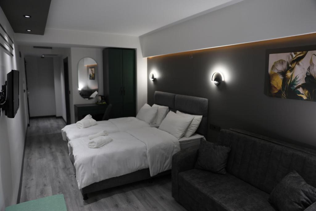 Postel nebo postele na pokoji v ubytování Aybek Ratio Hotel