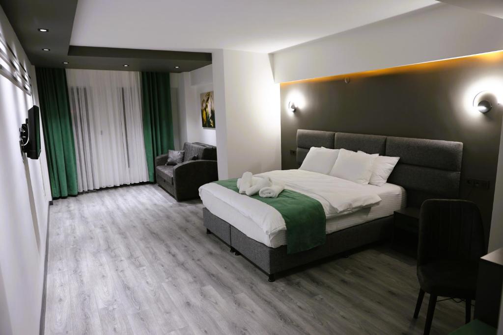 Postel nebo postele na pokoji v ubytování Aybek Ratio Hotel