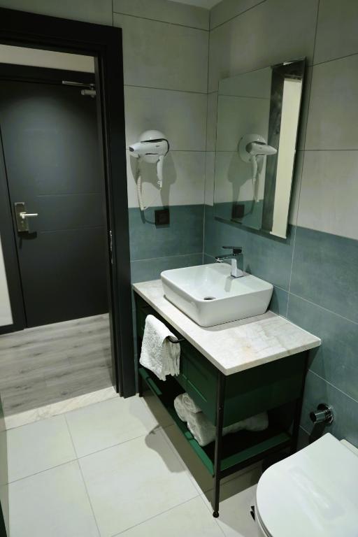 Koupelna v ubytování Aybek Ratio Hotel