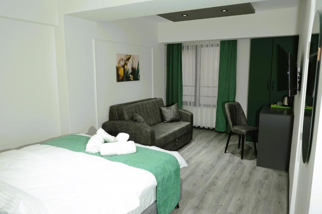 Postel nebo postele na pokoji v ubytování Aybek Ratio Hotel