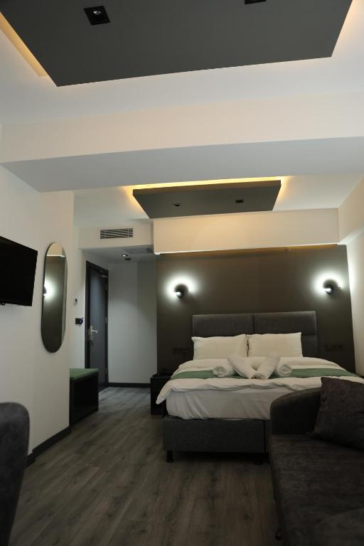 Postel nebo postele na pokoji v ubytování Aybek Ratio Hotel
