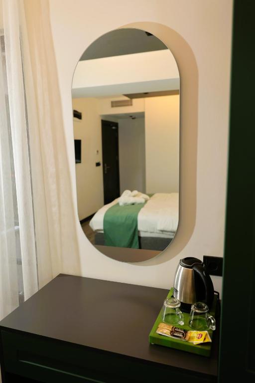 Postel nebo postele na pokoji v ubytování Aybek Ratio Hotel