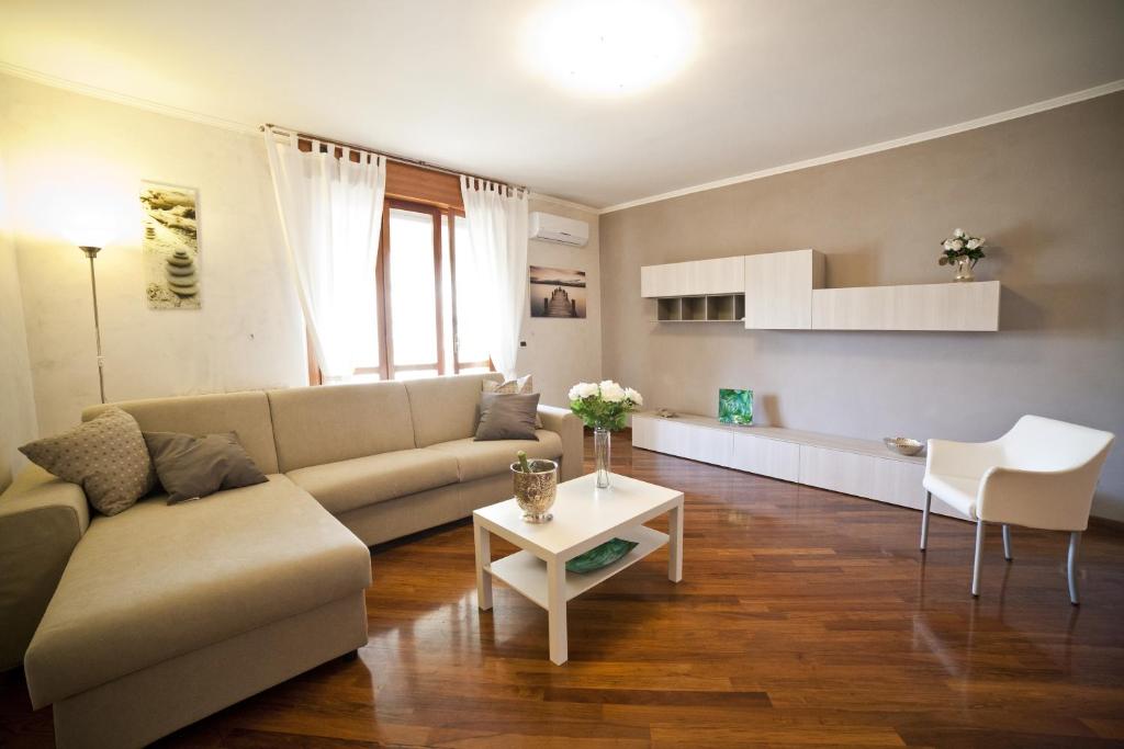 a living room with a couch and a table at Roman Holidays all'Eur in Rome