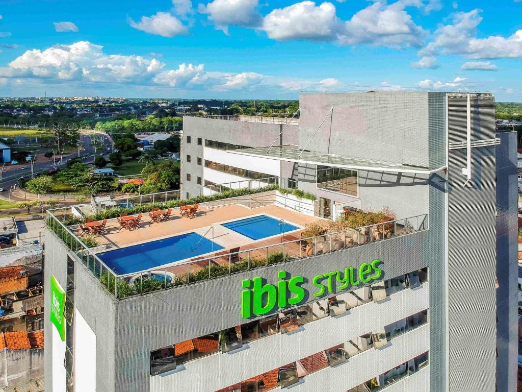 an office building with a big files sign on it at Ibis Styles Belém Hangar in Belém