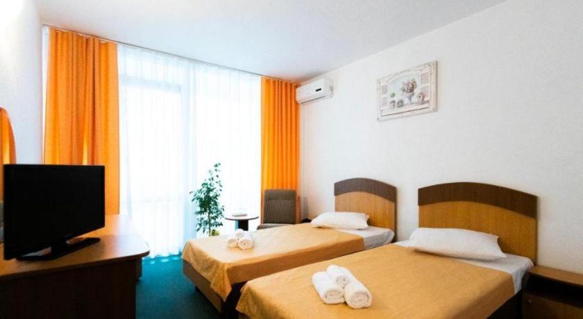 Postel nebo postele na pokoji v ubytování Hotel Siret Saturn
