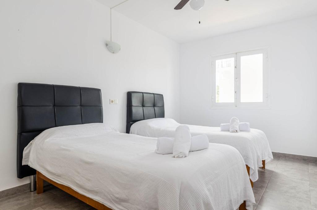 Posteľ alebo postele v izbe v ubytovaní Acapulco Apartments