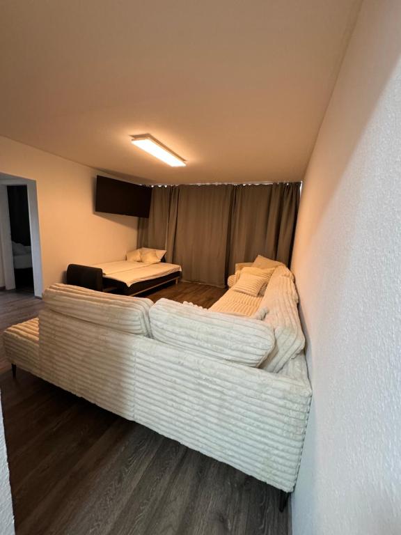 a room with two beds and a couch at Deluxe Apartment in Bonn