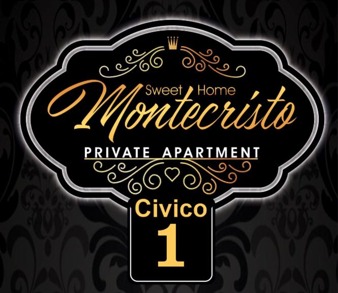 un cartello nero e oro che dice "invito monocolo" di Sweet Home Montecristo Civico 1 a Vibo Valentia