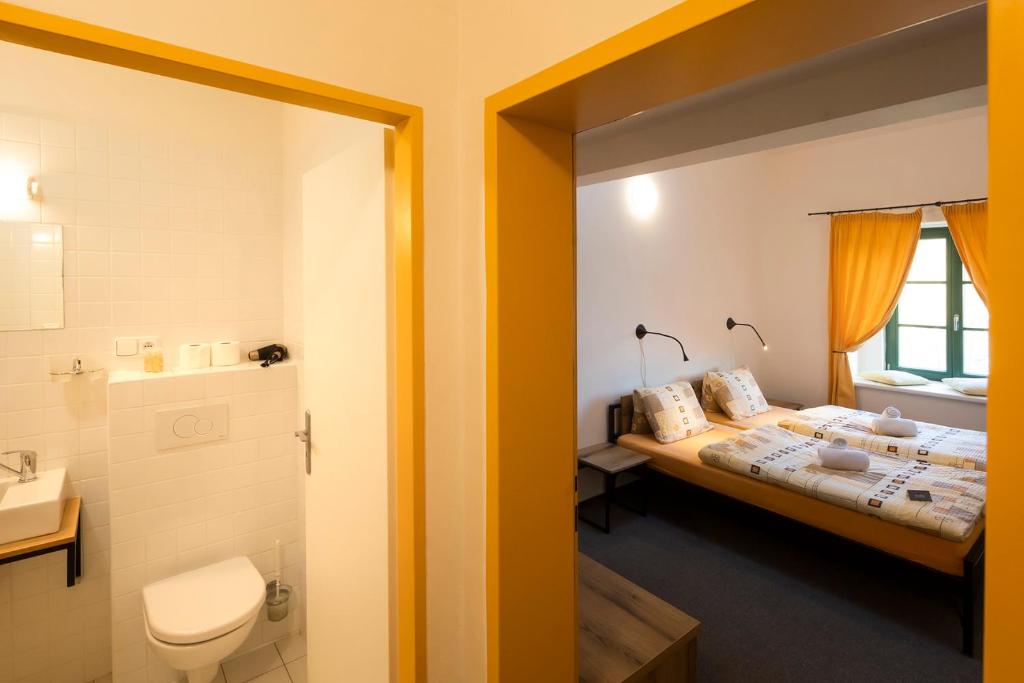 Postel nebo postele na pokoji v ubytování Wellness hotel Lihovar