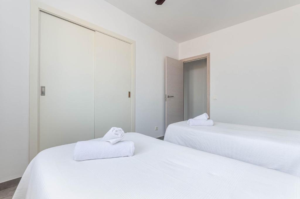 Posteľ alebo postele v izbe v ubytovaní Acapulco Apartments