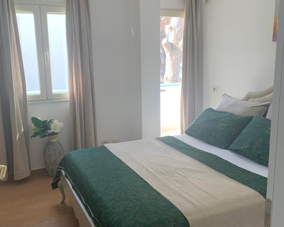 Postel nebo postele na pokoji v ubytování Villa Dyrrahu