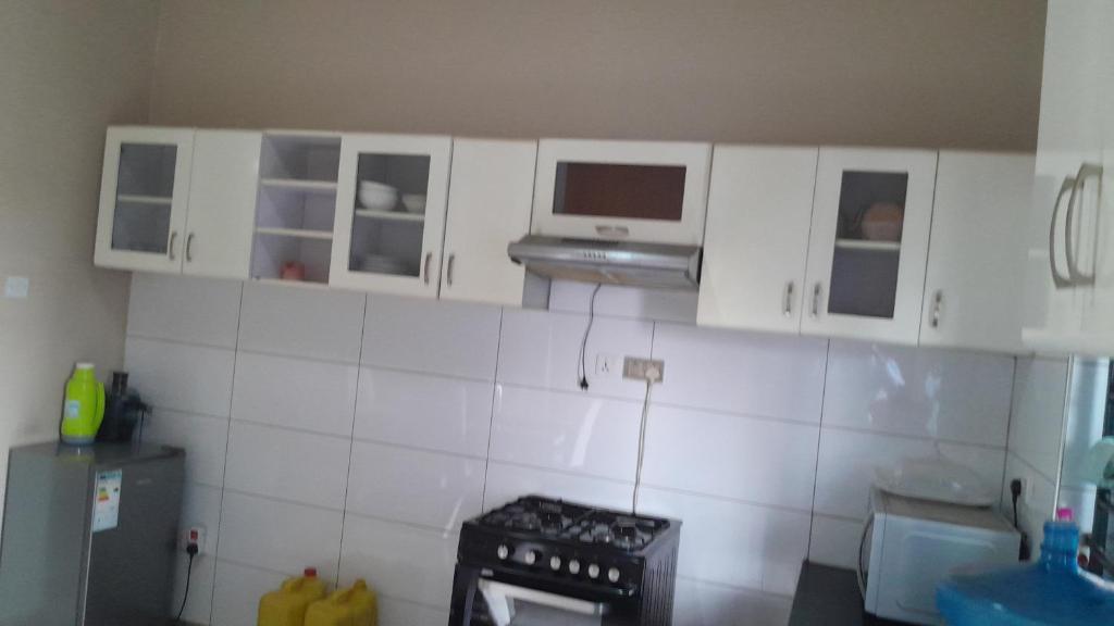Cuisine ou kitchenette dans l'établissement Mengo - Along Nabulagala Road