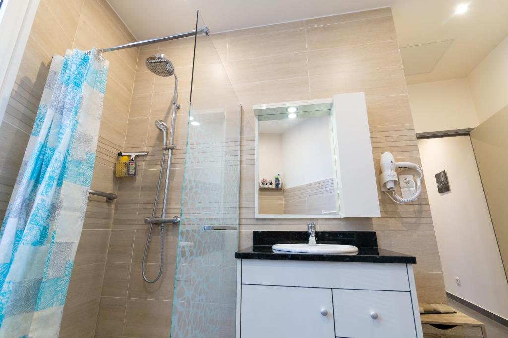 a bathroom with a shower and a sink at We Love Paris - Private Apartment in Vitry-sur-Seine