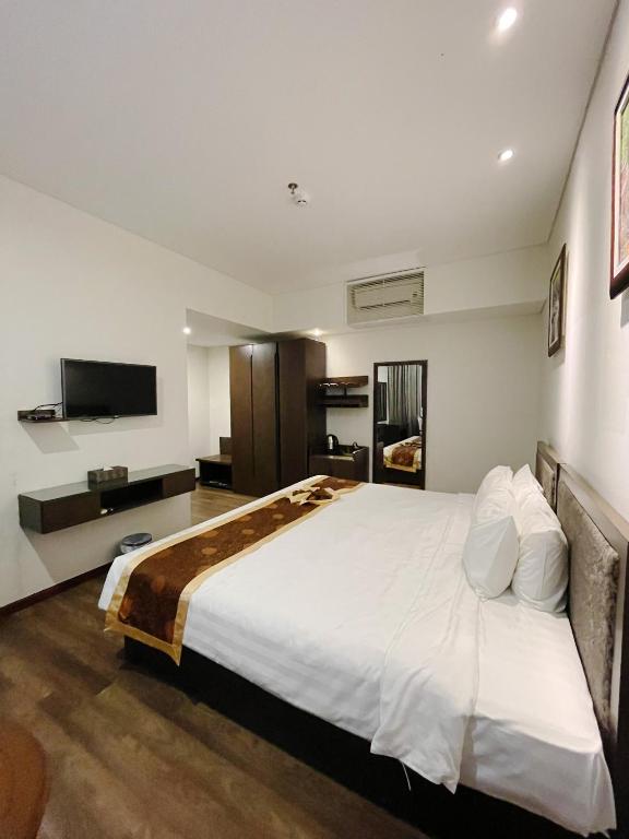 Postel nebo postele na pokoji v ubytování Danaciti Hotel
