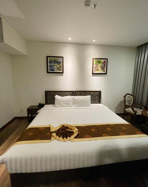 Postel nebo postele na pokoji v ubytování Danaciti Hotel