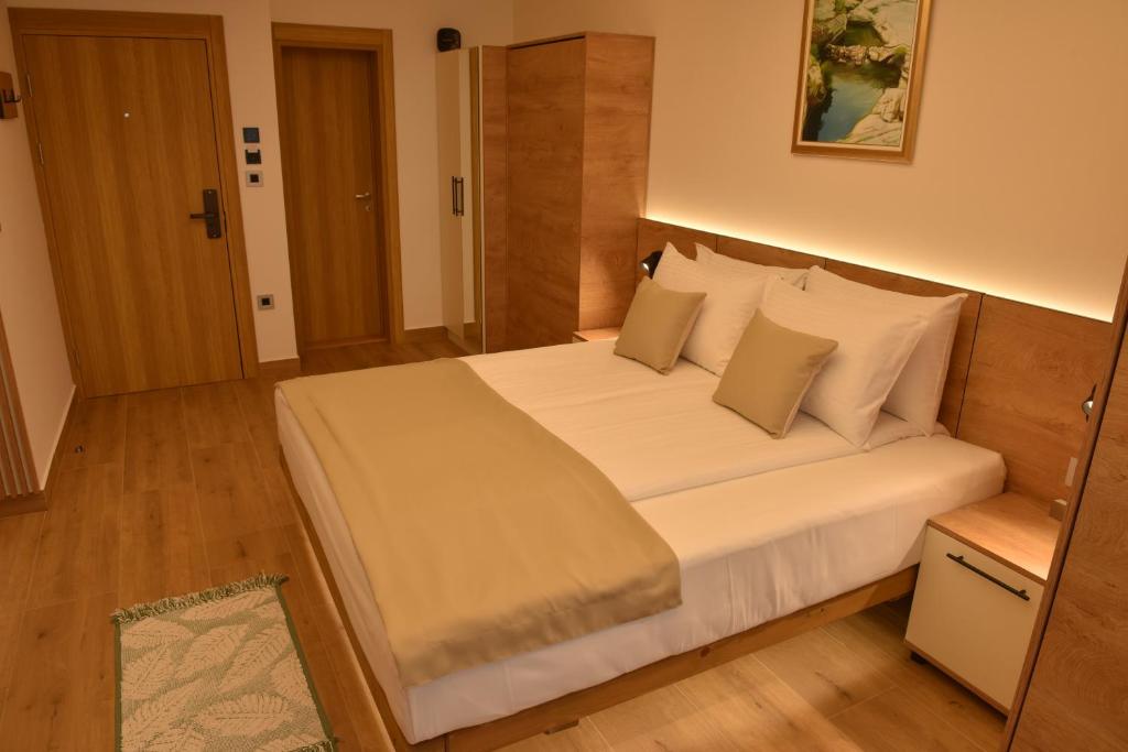 Postel nebo postele na pokoji v ubytování Hotel Zeleni Grad