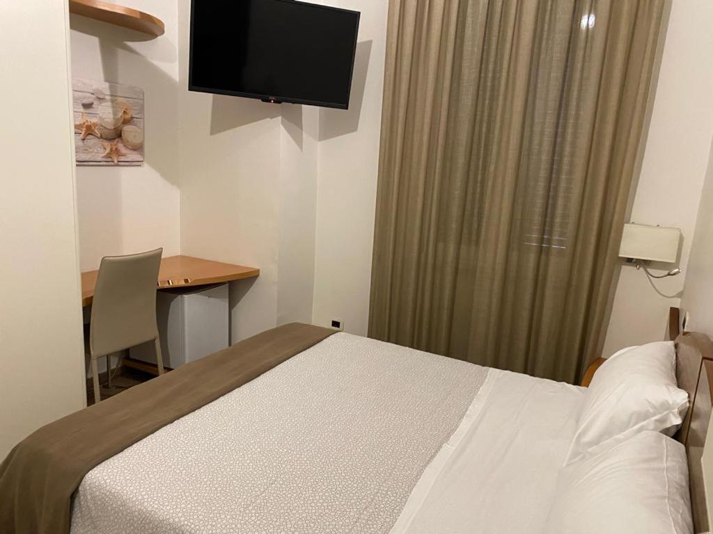 Postel nebo postele na pokoji v ubytování A 4 PASSI