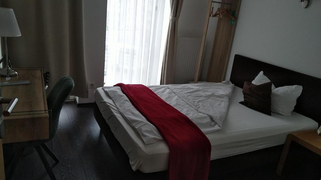 Postel nebo postele na pokoji v ubytování Hotel Gemini