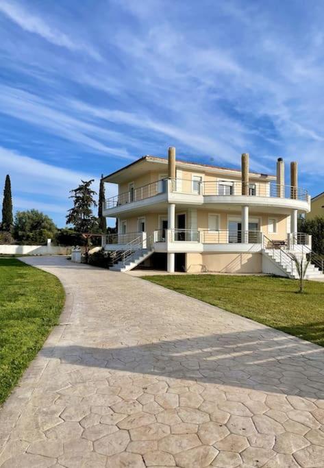 a large house on the side of a road at Villa Eva στην περιοχή Ερέτρια in Eretria