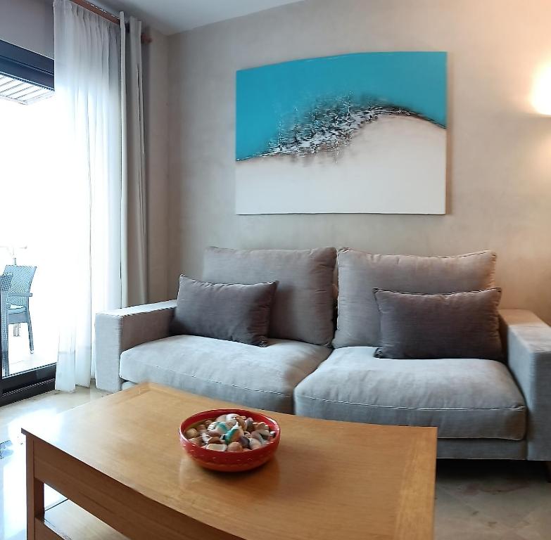 A seating area at Lovely apartment with pool & sea views - Marina Del Castillo 2129