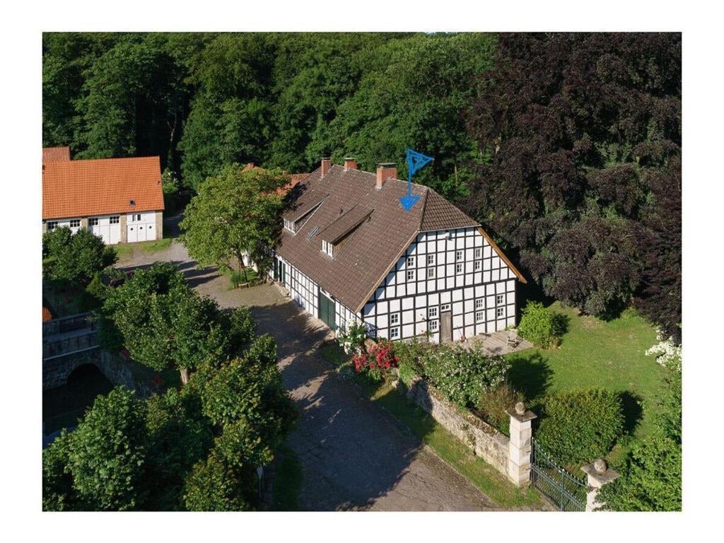 an overhead view of a large house with a roof at at the Haus Marck moated castle in Tecklenburg