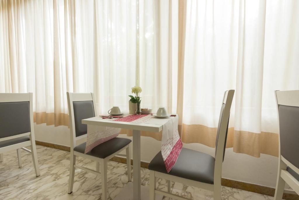 Un lugar para sentarse en Hotel Roma